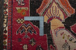 Backside of handmade 2000s Shiraz rug showing knot structure and weave density