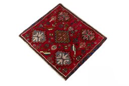 Corner detail of 2000s Shiraz rug showing border pattern and Wool pile