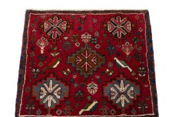 Surface texture of 2000s Shiraz rug with natural Wool and intricate pattern
