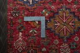 Backside of handmade 2000s Shiraz rug showing knot structure and weave density