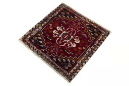 Corner detail of 2000s Shiraz rug showing border pattern and Wool pile