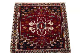 Surface texture of 2000s Shiraz rug with natural Wool and intricate pattern