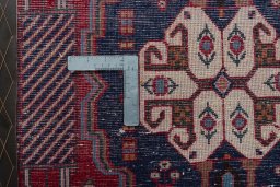 Backside of handmade 2000s Shiraz rug showing knot structure and weave density