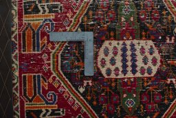 Backside of handmade 2000s Shiraz rug showing knot structure and weave density