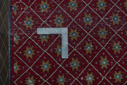Backside of handmade 2000s Shiraz rug showing knot structure and weave density