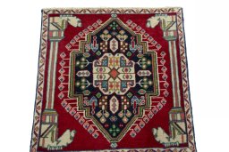 Surface texture of 2000s Shiraz rug with natural Wool and intricate pattern