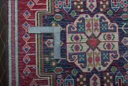 Backside of handmade 2000s Shiraz rug showing knot structure and weave density