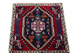Surface texture of 2000s Shiraz rug with natural Wool and intricate pattern