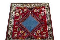 Surface texture of 2000s Shiraz rug with natural Wool and intricate pattern