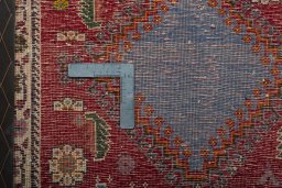 Backside of handmade 2000s Shiraz rug showing knot structure and weave density