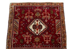 Surface texture of 2000s Shiraz rug with natural Wool and intricate pattern