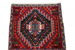 Surface texture of 2000s Shiraz rug with natural Wool and intricate pattern