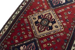 Backside of handmade New Shiraz rug showing knot structure and weave density