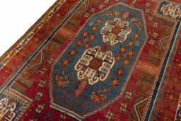Backside of handmade 2000s Shiraz rug showing knot structure and weave density