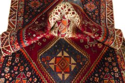 Corner detail of 2000s Shiraz rug showing border pattern and Wool pile
