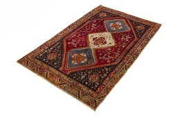 Corner detail of 2000s Shiraz rug showing border pattern and Wool pile