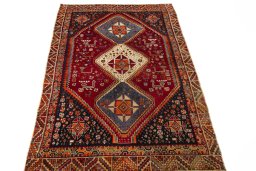 Surface texture of 2000s Shiraz rug with natural Wool and intricate pattern