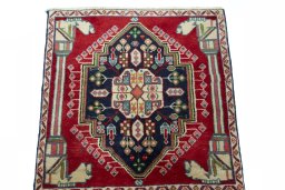 Backside of handmade 2000s Shiraz rug showing knot structure and weave density