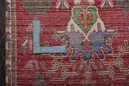 Backside of handmade 2000s Shiraz rug showing knot structure and weave density