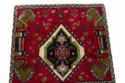 Surface texture of 2000s Shiraz rug with natural Wool and intricate pattern
