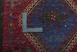 Backside of handmade 2000s Shiraz rug showing knot structure and weave density