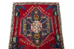 Surface texture of 2000s Shiraz rug with natural Wool and intricate pattern