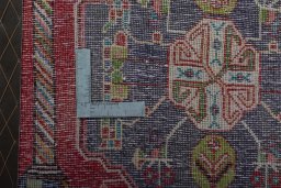 Backside of handmade 2000s Shiraz rug showing knot structure and weave density
