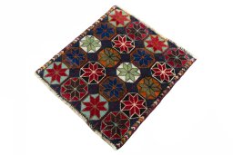Corner detail of 2000s Shiraz rug showing border pattern and Wool pile