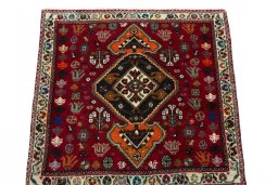 Surface texture of 2000s Shiraz rug with natural Wool and intricate pattern