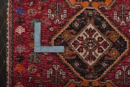 Backside of handmade 2000s Shiraz rug showing knot structure and weave density