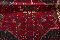 Corner detail of 2000s Shiraz rug showing border pattern and Wool pile