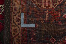 Surface texture of 2000s Shiraz rug with natural Wool and intricate pattern
