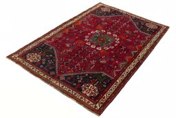 Corner detail of 2000s Shiraz rug showing border pattern and Wool pile