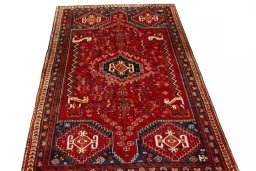 Surface texture of 2000s Shiraz rug with natural Wool and intricate pattern