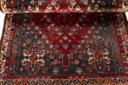 Corner detail of 2000s Shiraz rug showing border pattern and Wool pile
