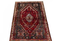 Surface texture of 2000s Shiraz rug with natural Wool and intricate pattern