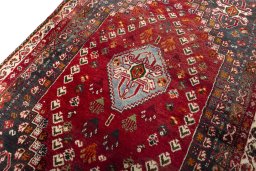 Backside of handmade 2000s Shiraz rug showing knot structure and weave density