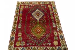 Surface texture of 2000s Shiraz rug with natural Wool and intricate pattern