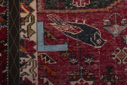 Surface texture of 2000s Shiraz rug with natural Wool and intricate pattern
