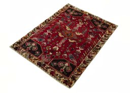 Corner detail of 2000s Shiraz rug showing border pattern and Wool pile
