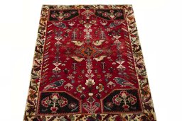 Surface texture of 2000s Shiraz rug with natural Wool and intricate pattern
