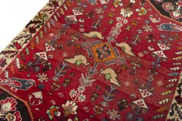 Backside of handmade 2000s Shiraz rug showing knot structure and weave density