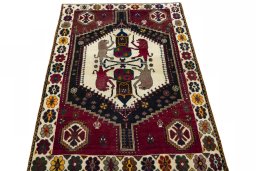 Surface texture of 2000s Shiraz rug with natural Wool and intricate pattern