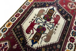Backside of handmade 2000s Shiraz rug showing knot structure and weave density
