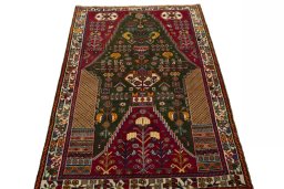 Surface texture of 2000s Shiraz rug with natural Wool and intricate pattern