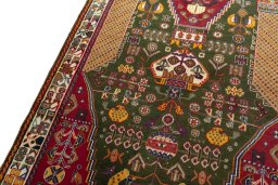Backside of handmade 2000s Shiraz rug showing knot structure and weave density