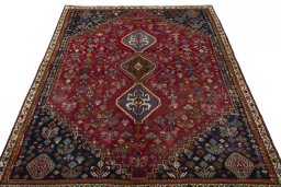 Surface texture of 1970s Shiraz rug with natural Wool and intricate pattern