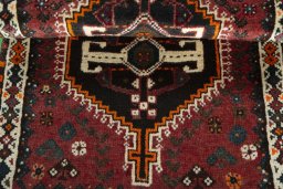 Full view of 2000s Shiraz rug from Iran / Persia, 124 × 72 cm in Red tones