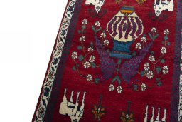 Backside of handmade 2000s Shiraz rug showing knot structure and weave density
