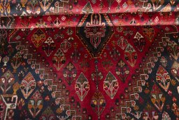 Corner detail of 2000s Shiraz rug showing border pattern and Wool pile